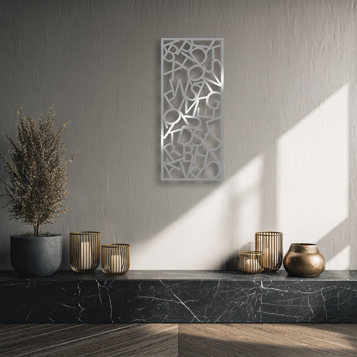 Vertically oriented rectangular metal wall decor features abstract typography chaos with scattered letters, perfect for modern letter composition.