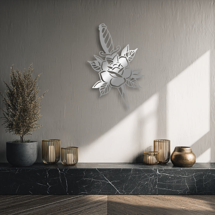 Dramatic color contrast emphasizes the bold Rose & Dagger Silhouette metal wall decor against a subtly textured wall.