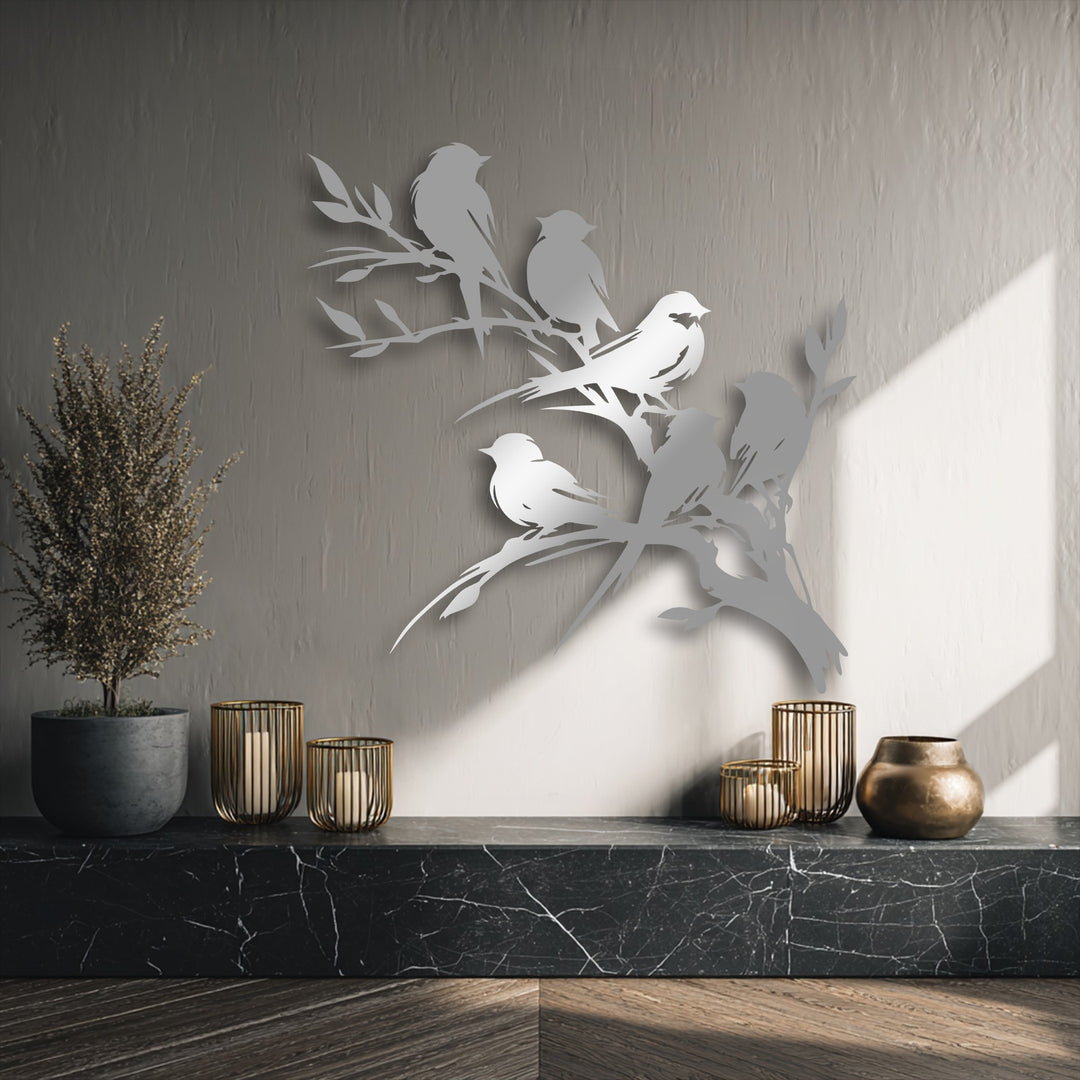 The superior material quality of this unique metal wall art showcases finely crafted birds on a branch with a striking metallic sheen.