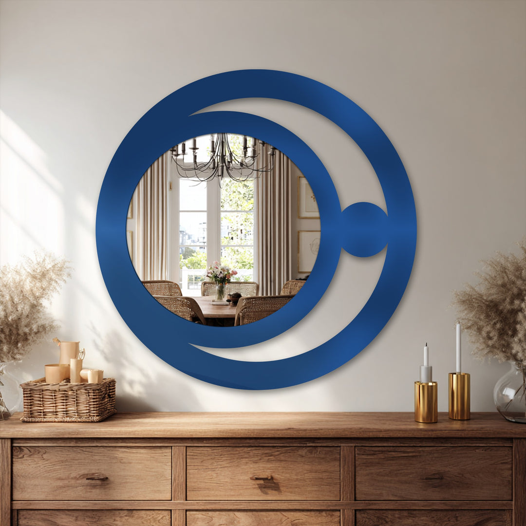 Overlapping circles create depth and layers in this modern crescent orb design framed wall mirror, a minimalist piece that adds intrigue to any room.