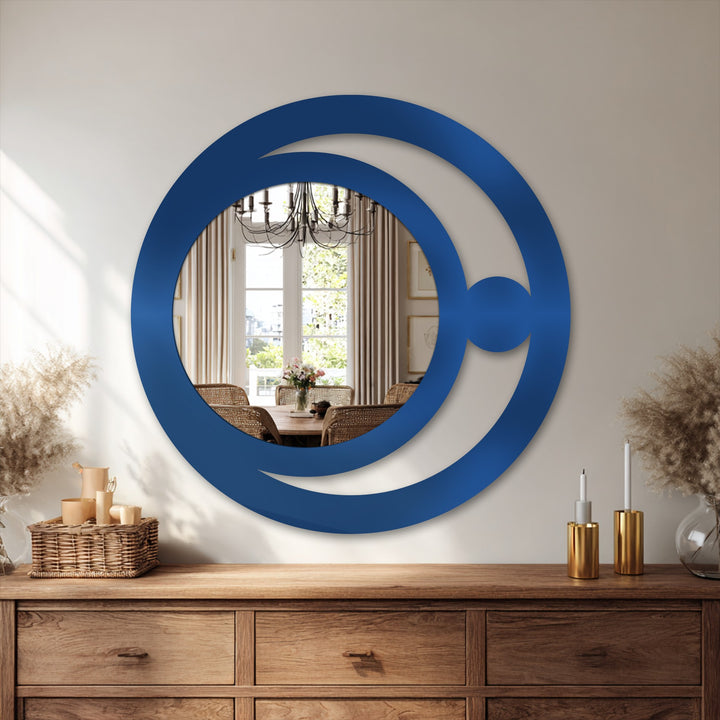 Overlapping circles create depth and layers in this modern crescent orb design framed wall mirror, a minimalist piece that adds intrigue to any room.
