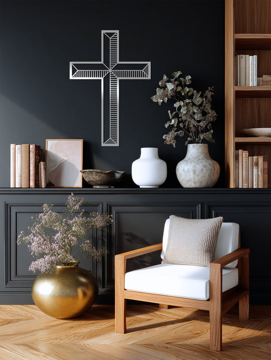 Textured metal artwork showcases a silver linework cross wall art with a smooth, reflective surface contrasting against the matte black background.