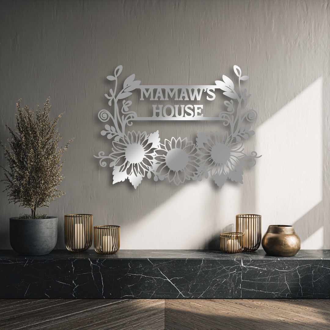 The sweeping floral motifs and three vibrant sunflowers create inviting organic forms in this personalized sunflower family name metal wall decor.