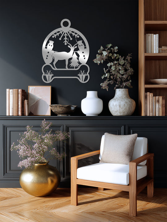 Creating depth and layers, the snowland serenity metal art for wall depicts a reindeer and snowman scene with a unique, festive, holiday design.