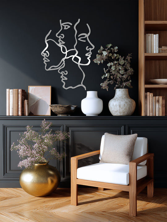 Showcasing the layering effect, this unique metal wall art presents an abstract line sculpture, 'Unity of Faces,' creating a modern focal point.