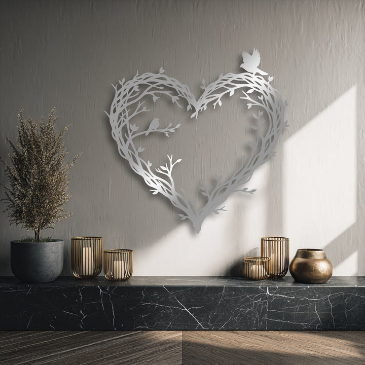 The scene displays a soft, warm color temperature, highlighting the intricately designed bird & branch heart metal art for wall.