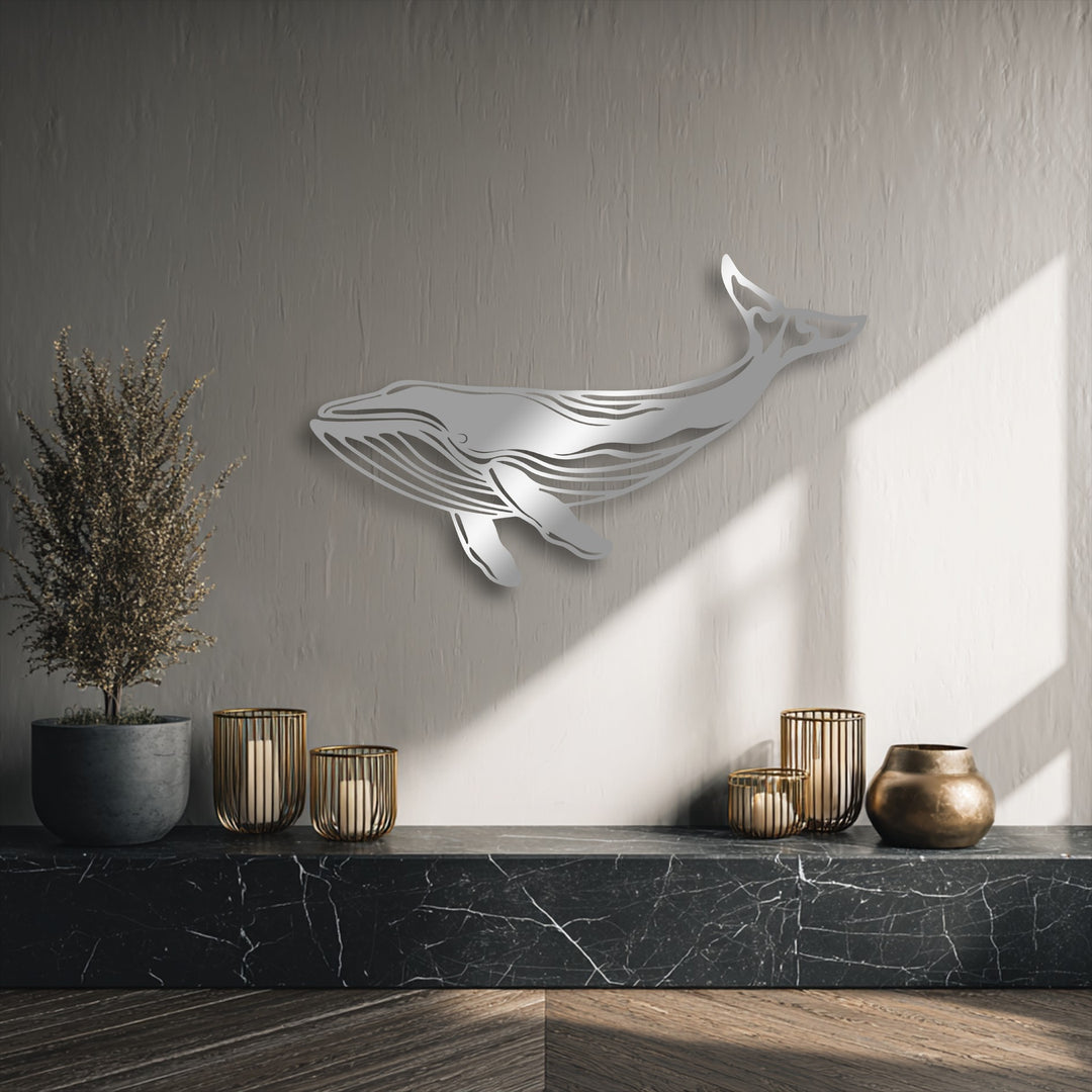 Soft greige dominates, featuring a majestic silver whale metal art for wall above a striking black marble shelf.