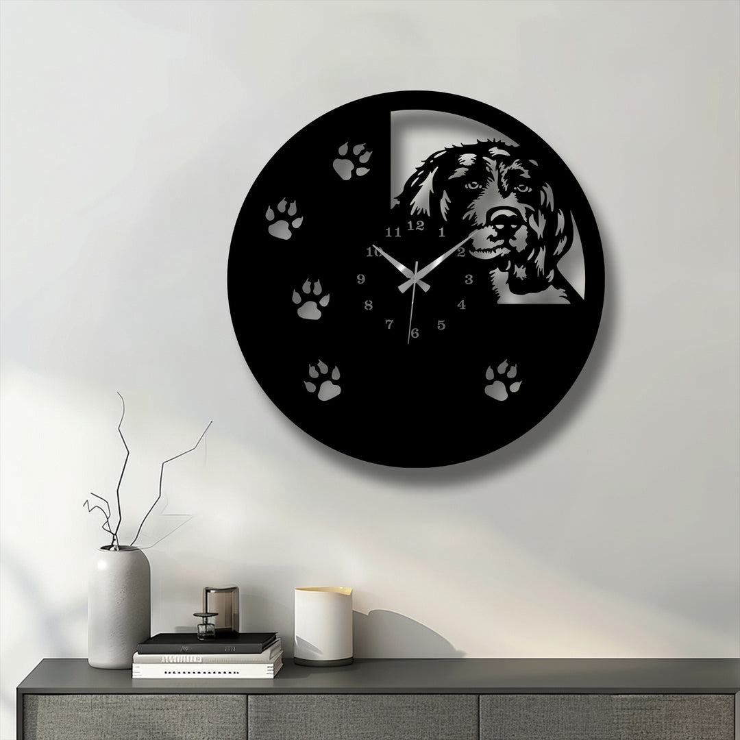 The dominant color is a striking black on this unique metal wall art dog silhouette wall clock featuring paw prints.