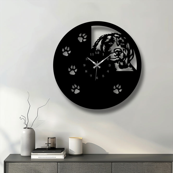 The dominant color is a striking black on this unique metal wall art dog silhouette wall clock featuring paw prints.