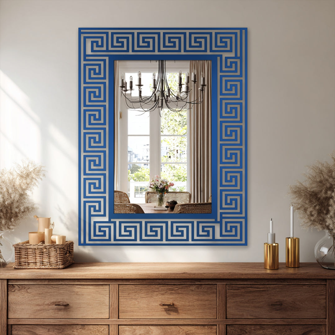 This central subject features decorating with wall mirrors using a Greek key pattern floor mirror showcasing a black metal artwork design.