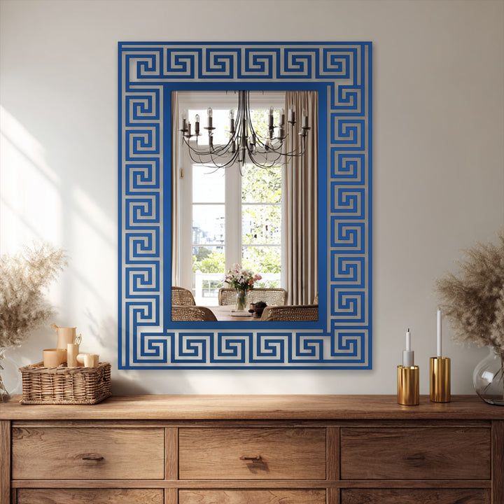 This central subject features decorating with wall mirrors using a Greek key pattern floor mirror showcasing a black metal artwork design.