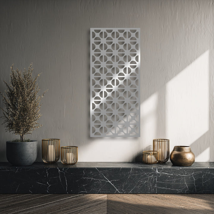 The elegant geometric circle pattern metal wall art is the striking focal point, serving as modern decoration wall art in a stylish interior.