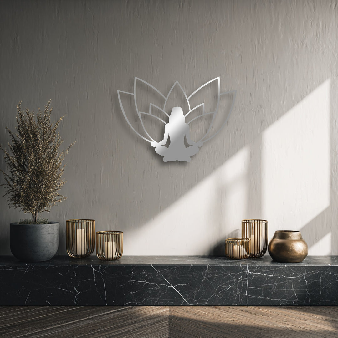 The visual rhythm in this unique metal wall art, featuring a lotus meditation silhouette, harmonizes with the display's elements.