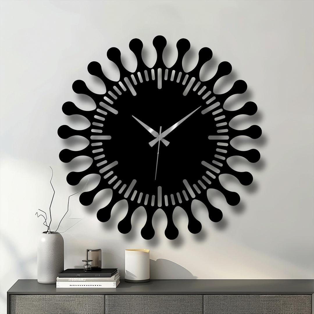 Showcasing the depth and layers of this modern sunburst design, a stunning piece of metal artwork creates a striking three-dimensional effect.