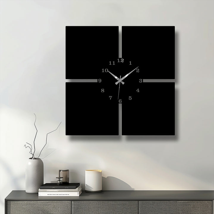 The stark contrast from the black minimal panels of this decorative metal art wall clock to the crisp white wall is striking, highlighted by sleek silver numbers and hands.