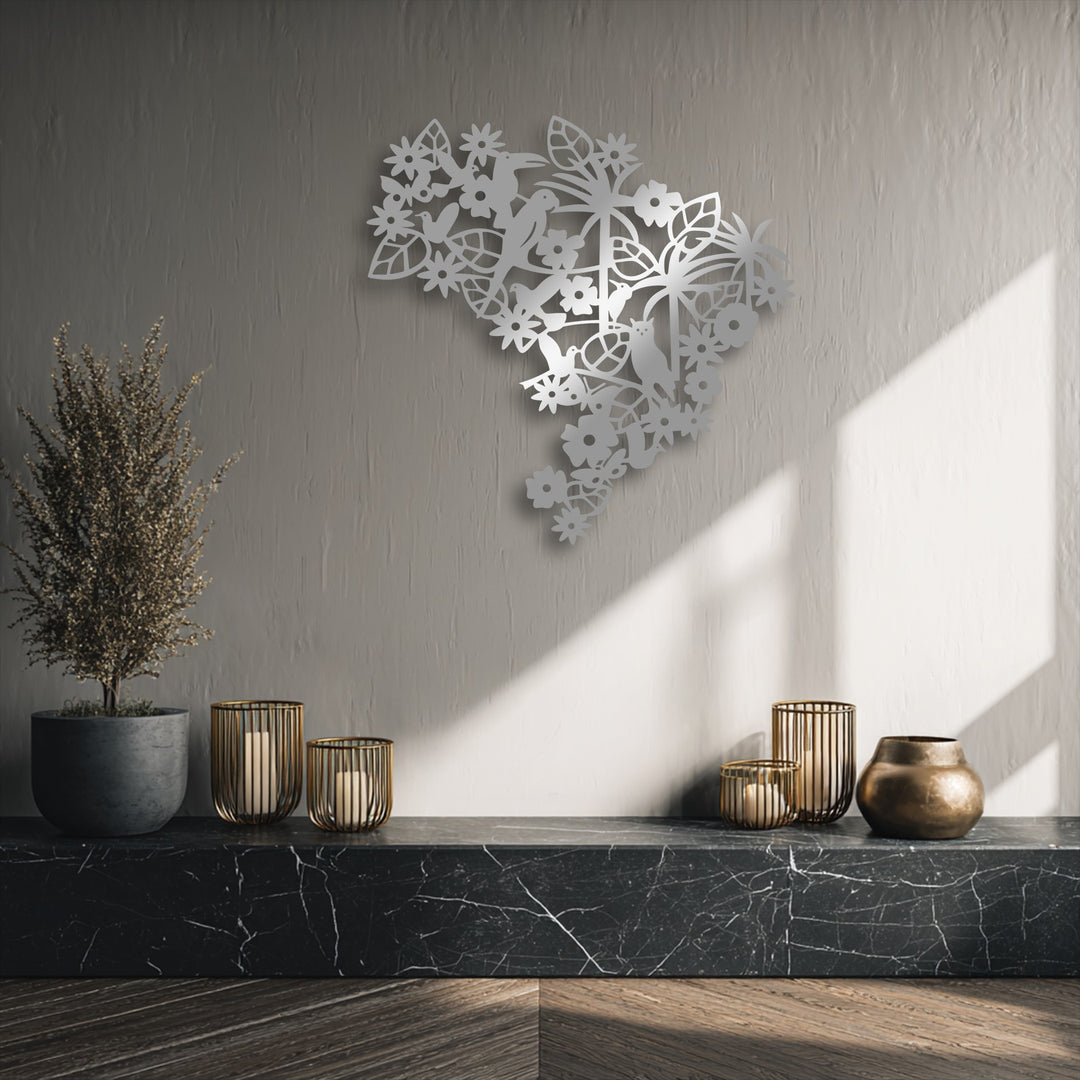 Soft rays of sunlight gently illuminate the textured wall where a beautiful Floral Bird Garden metal wall decor piece casts subtle shadows.