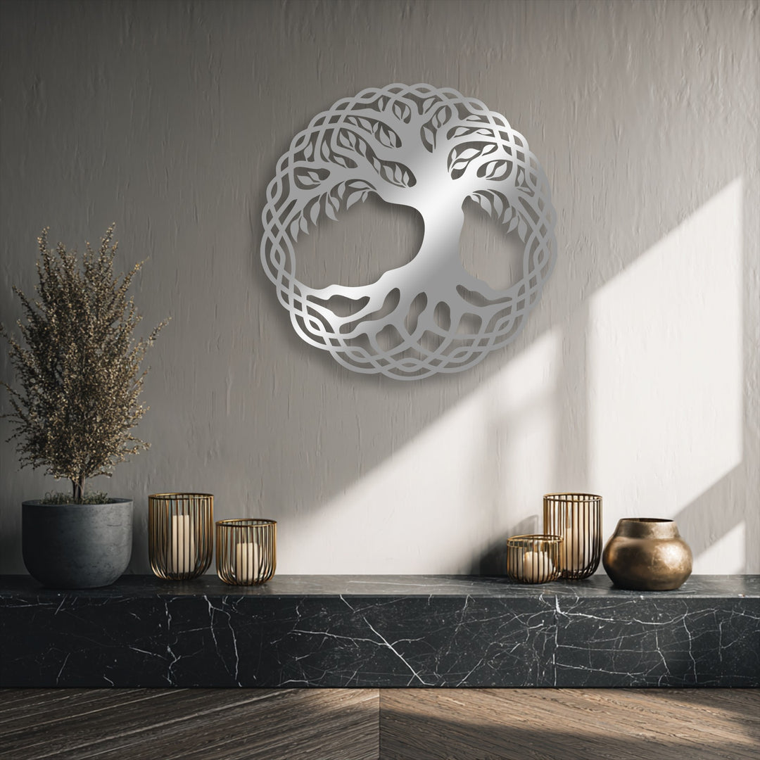 The realistic detail of the intricate Celtic Tree of Life metal artwork shines, its polished silver form beautifully contrasting a textured wall.