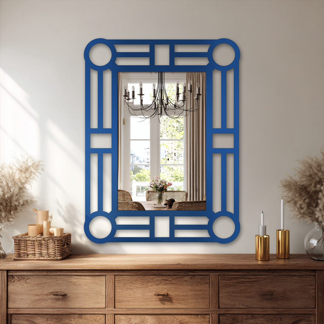 Geometric blue-framed mirror with circle accents becomes the loudest element, a bold statement piece that serves as inspiration for decorating with wall mirrors.