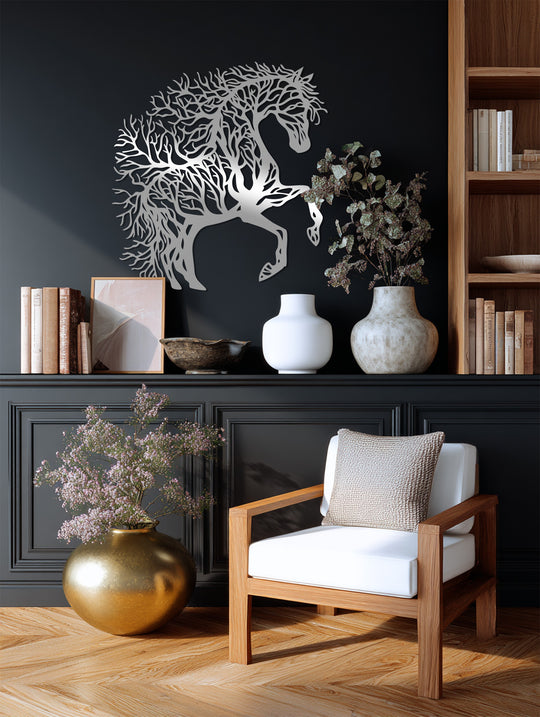 Illuminating the wall, light and shadow emphasize the intricate details of this majestic tree horse, a unique metal wall art sculpture.
