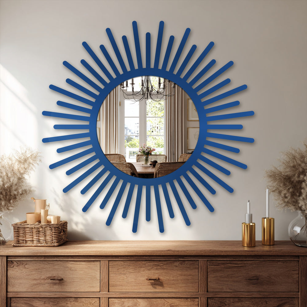 Oriented horizontally and featuring a round shape, this sunburst mirror showcases a stylish approach to decorating with wall mirrors.