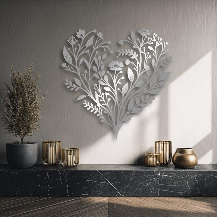 The realistic detail in this botanical heart metal art for wall shows intricate floral patterns casting subtle shadows on a textured wall.