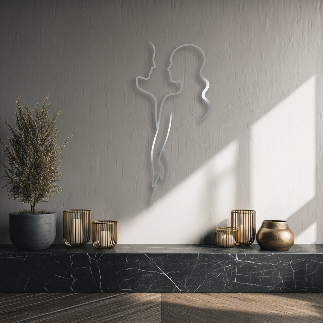The abstract elegance of this decorative metal art displays a minimalist couple line love silhouette, bringing a modern aesthetic to the space.