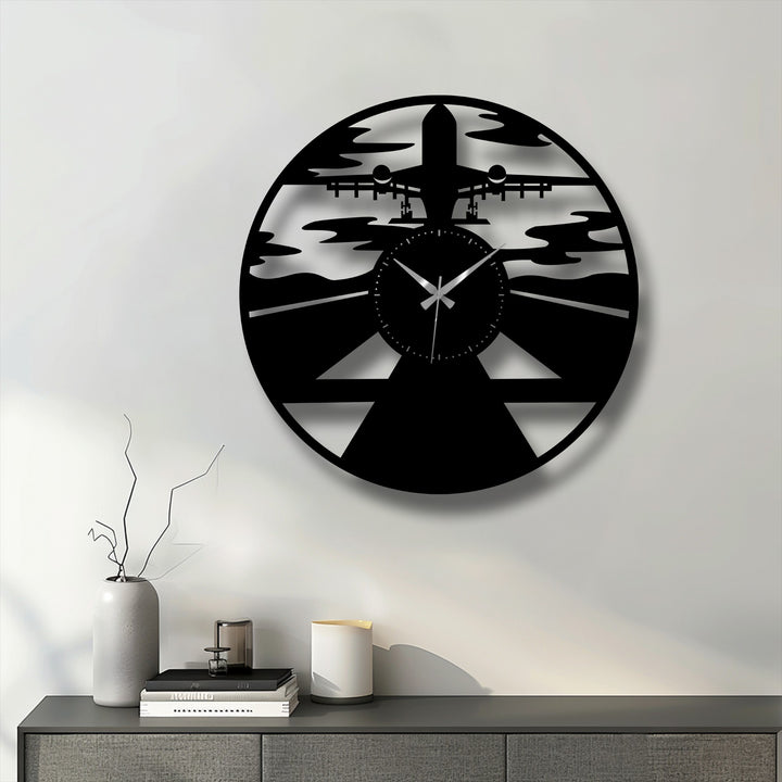 Contrasting light and deep shadows dramatically highlight the intricate airplane silhouette on this stunning decorative metal art wall clock.