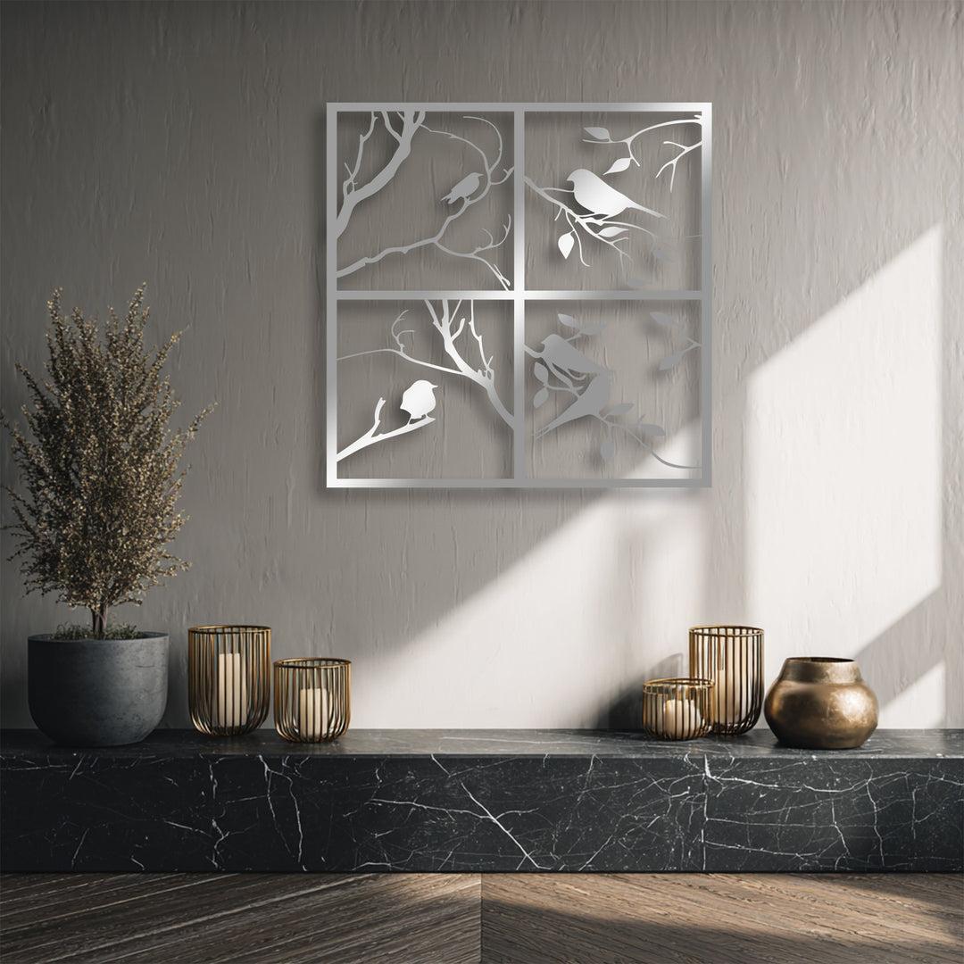 The striking color contrast highlights the gleaming four panel bird silhouette unique metal wall art against the muted wall and dark marble.