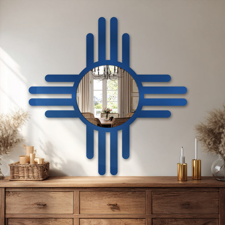 Displayed against a neutral backdrop, the bathroom mirror reflects a warmly lit dining room, complemented by a rustic wooden sideboard, showcasing decoration wall art.