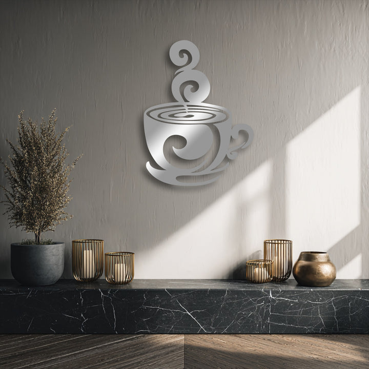 Rough wall textures contrast with the polished metallic swirling coffee cup decoration wall art, complemented by a veined marble shelf and a dried plant.