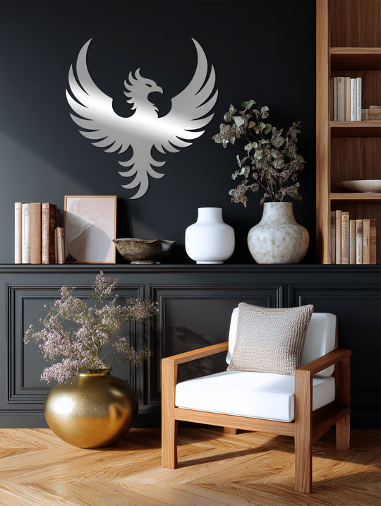 Highlighting the bird's form, the polished, silver decoration wall art depicts a powerful phoenix rising against a dark backdrop, symbolizing strength.