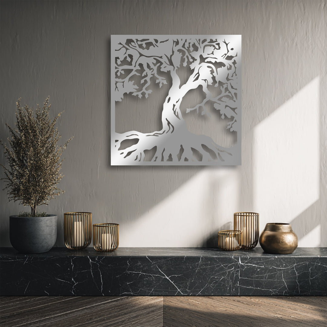 Soft light and gentle shadows caress the wall featuring a stunning Majestic Tree Silhouette metal artwork, highlighting its organic roots and branches.