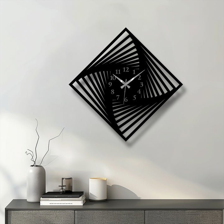 Predominantly light grey and off-white walls highlight the striking black twisted square metal wall decor clock with an optical design.