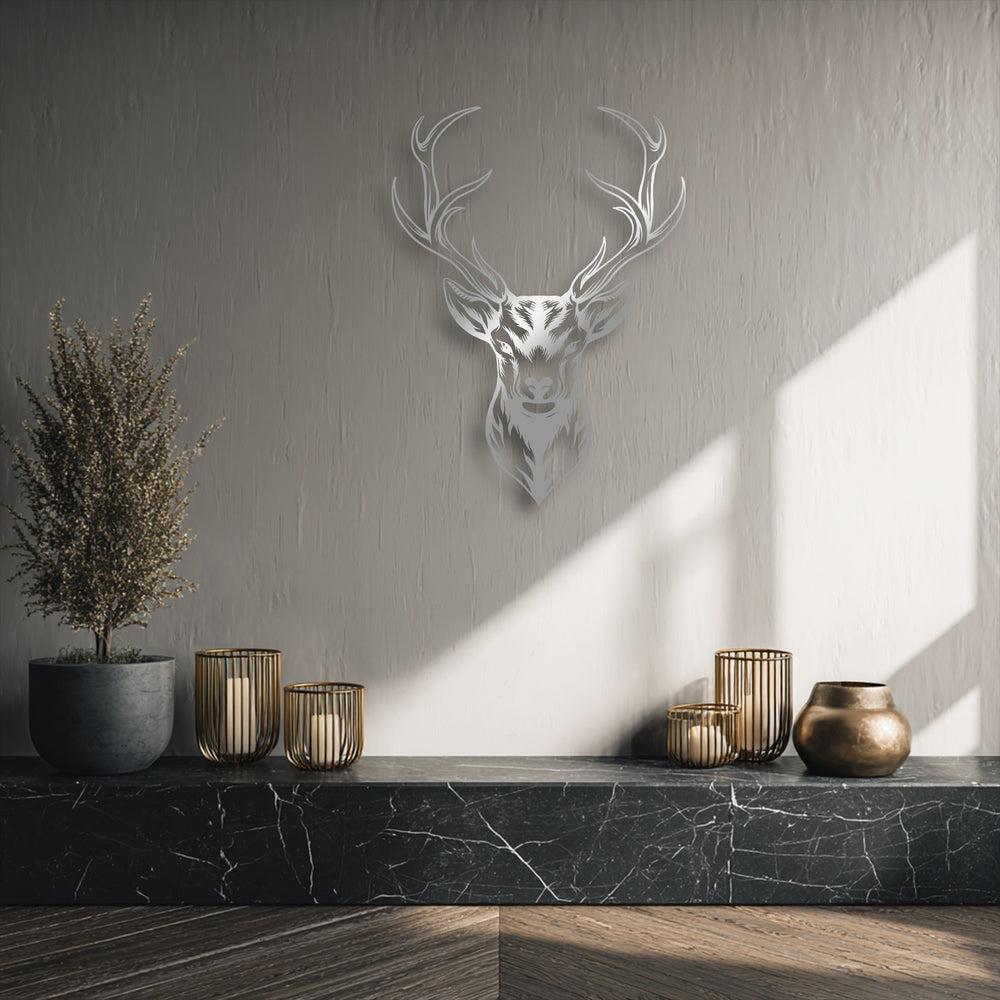 Elegant negative space around the majestic deer head metal art for wall highlights its modern wildlife antler design on a textured grey wall.