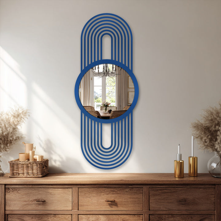 Reflected light draws the eye to the dining room interior within this modern arch line framed wall mirror, contrasted by its blue metal frame.