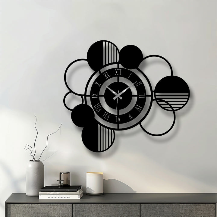Foreground staging includes a gray sideboard with modern decoration wall art and a gray vase with bare branches, complementing the metal circle clock.