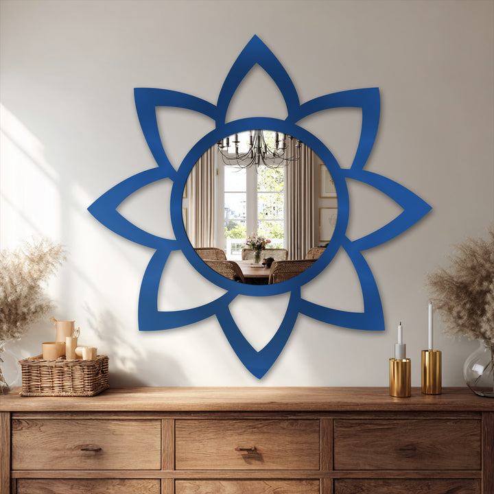 Geometric petal shapes form an eye-catching modern mirror with a circular reflective surface, creating a striking and decorative wall art piece.