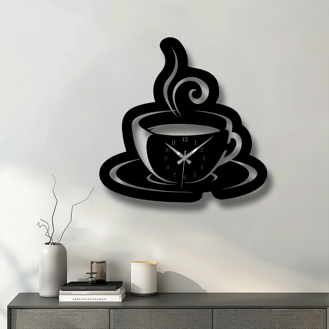 The depth and layers of this black coffee cup metal artwork wall clock are highlighted by its pronounced shadow against the white wall.