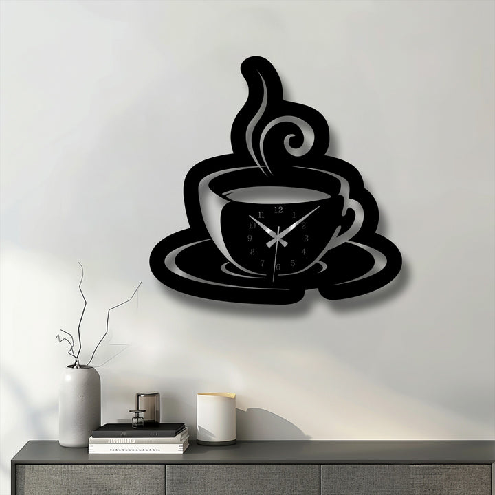 The depth and layers of this black coffee cup metal artwork wall clock are highlighted by its pronounced shadow against the white wall.