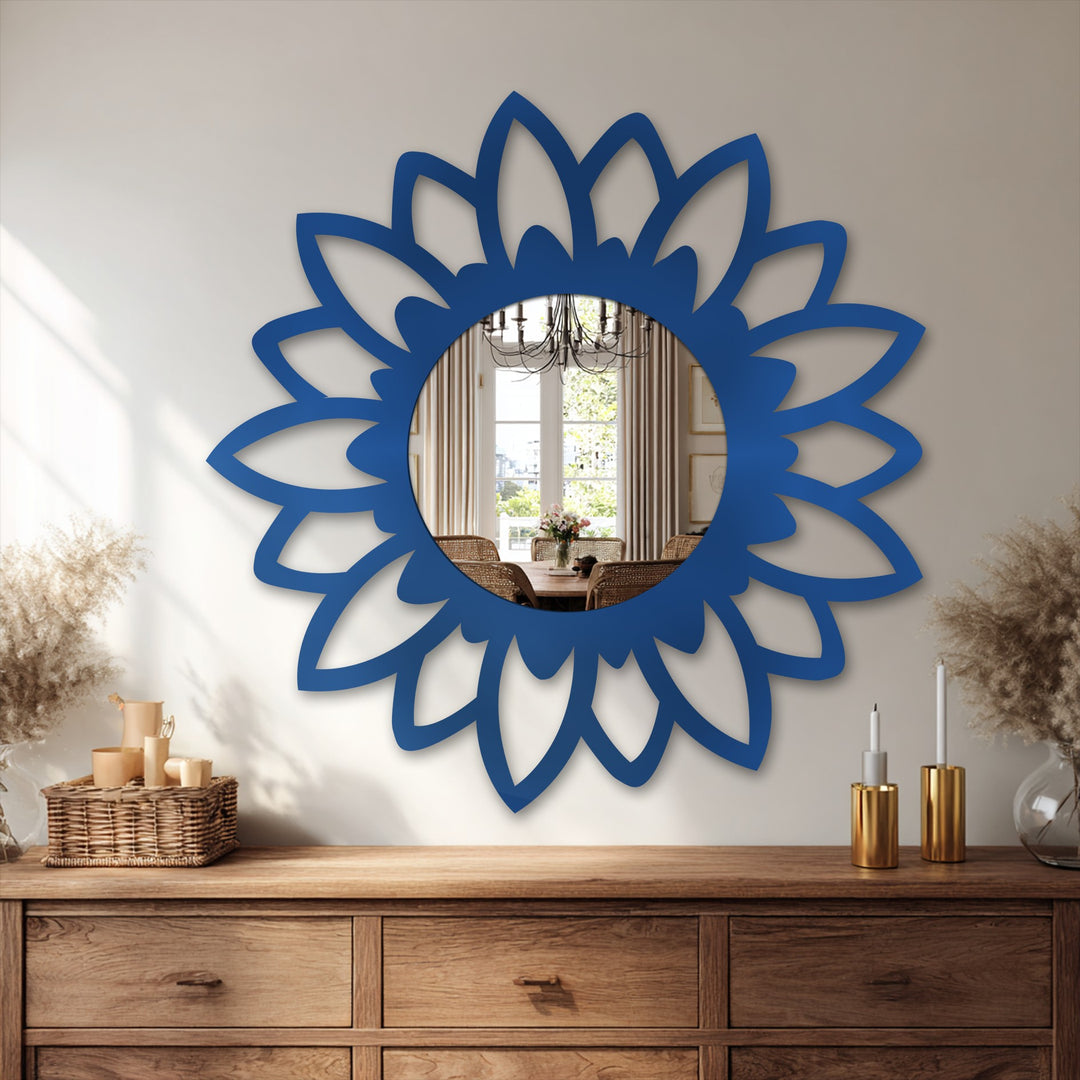 The stillness of the Bloom Silhouette modern mirror captures a reflected dining scene within its azure floral frame, evoking quiet elegance on the wooden dresser.