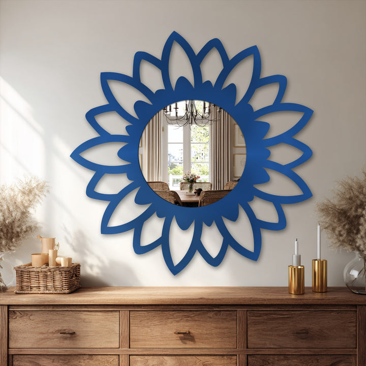 The stillness of the Bloom Silhouette modern mirror captures a reflected dining scene within its azure floral frame, evoking quiet elegance on the wooden dresser.