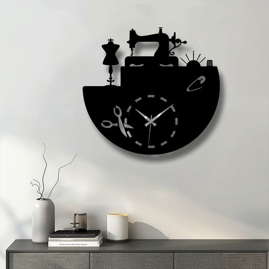 The sharp edges and distinct borders of the black metal wall decor beautifully outline the tailor studio inspired sewing clock design.