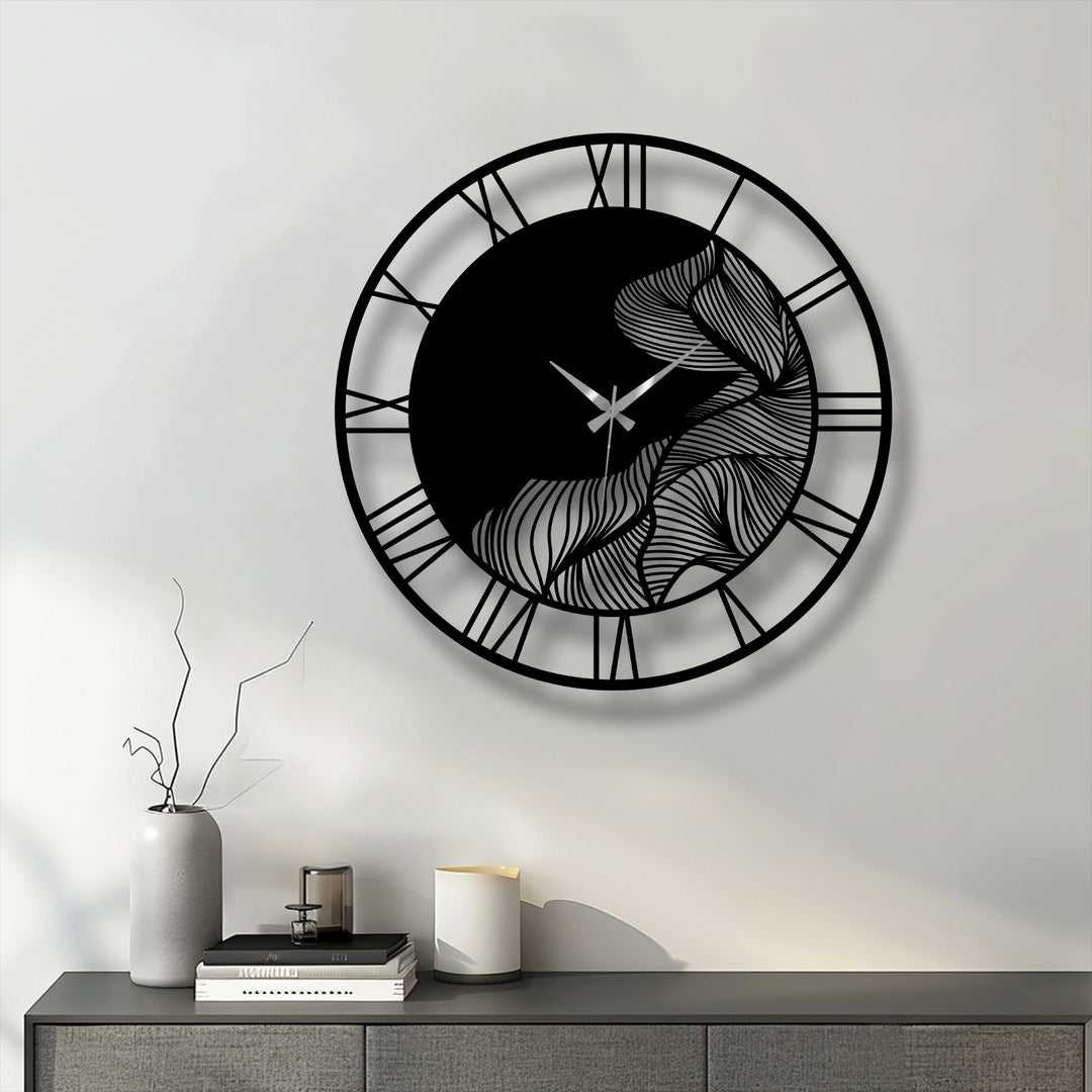 Featuring a sleek black finish, this abstract leaf metal wall clock showcases unique metal wall art with Roman numerals, offering modern botanical decor.