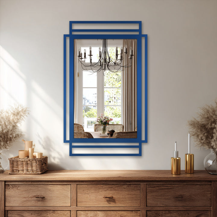 Cool color temperature highlights the bright light reflected in this framed wall mirror with a modern geometric black frame.