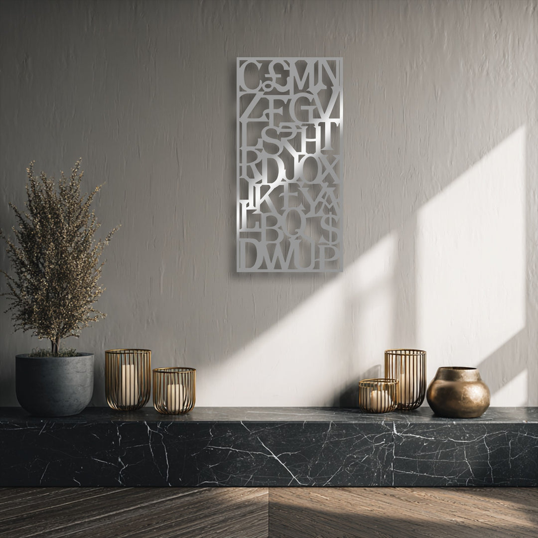 A seamless transition from brilliant sunlight to subtle wall shadows accentuates the silver unique metal wall art typography.