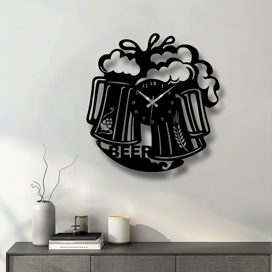 The bold, black finish of this metal artwork beer mug wall clock highlights its frothy beverage design with a pub style.