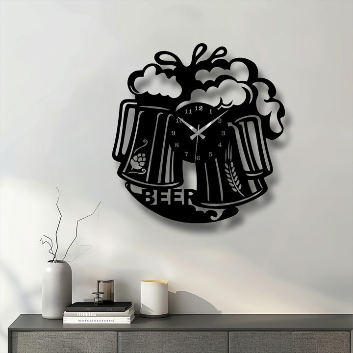 The bold, black finish of this metal artwork beer mug wall clock highlights its frothy beverage design with a pub style.