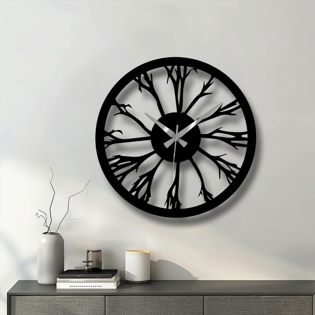 The focal point highlights the intricate tree silhouette design of this black metal wall clock, offering a stunning piece of decoration wall art with its modern nature-inspired aesthetic.