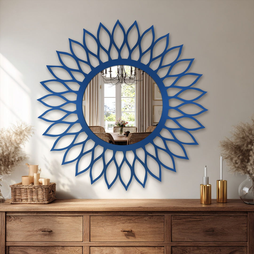 Horizontally oriented radiant leaf halo decorative mirror features a circular reflective surface surrounded by stylized petal shapes.