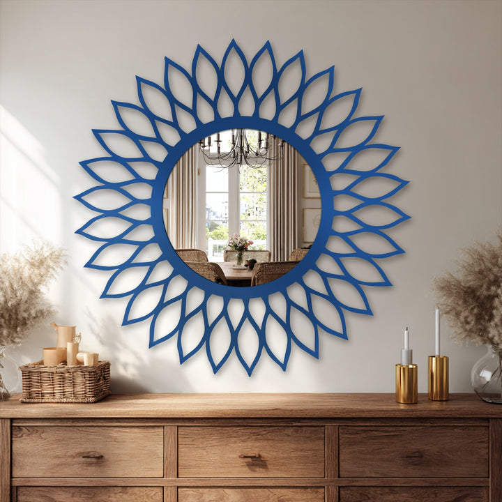 Horizontally oriented radiant leaf halo decorative mirror features a circular reflective surface surrounded by stylized petal shapes.